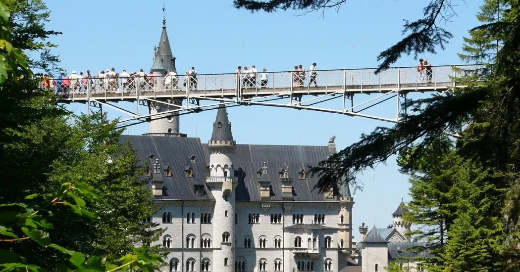 Neuschwanstein Castle seen from Mary’s Bridge by the tourists