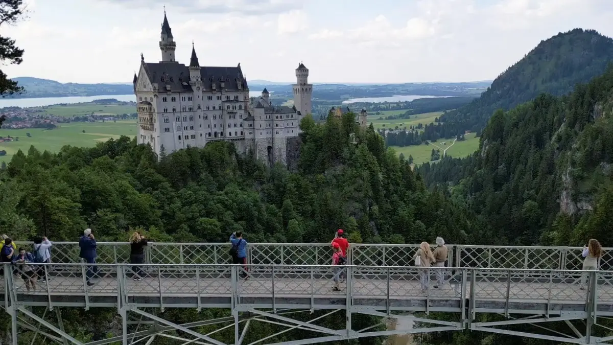 Neuschwanstein Castle seen from Mary’s Bridge by the tourists